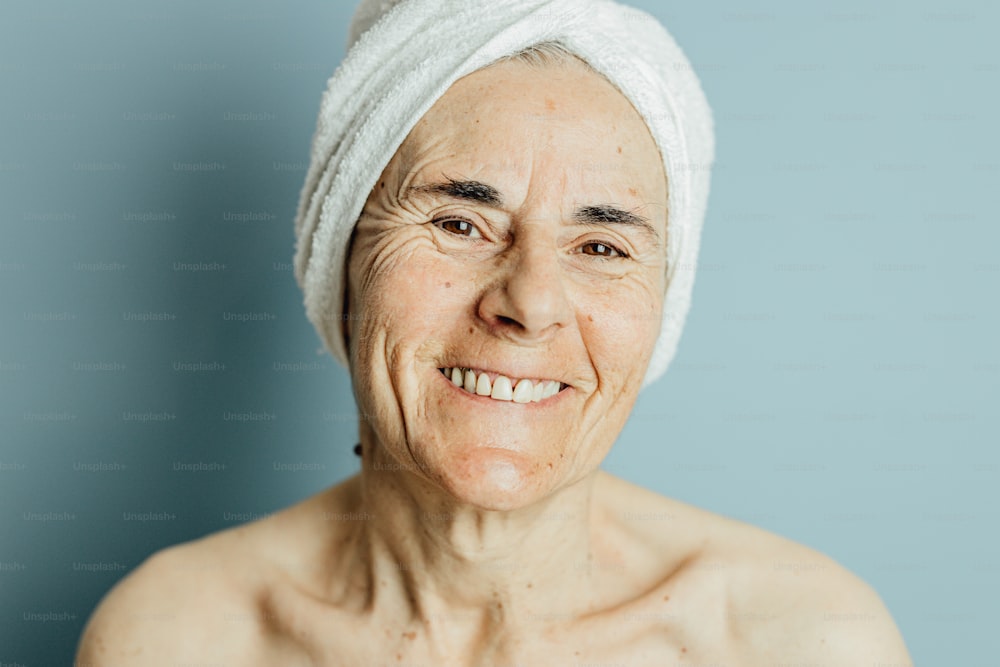 an older woman with a towel on her head