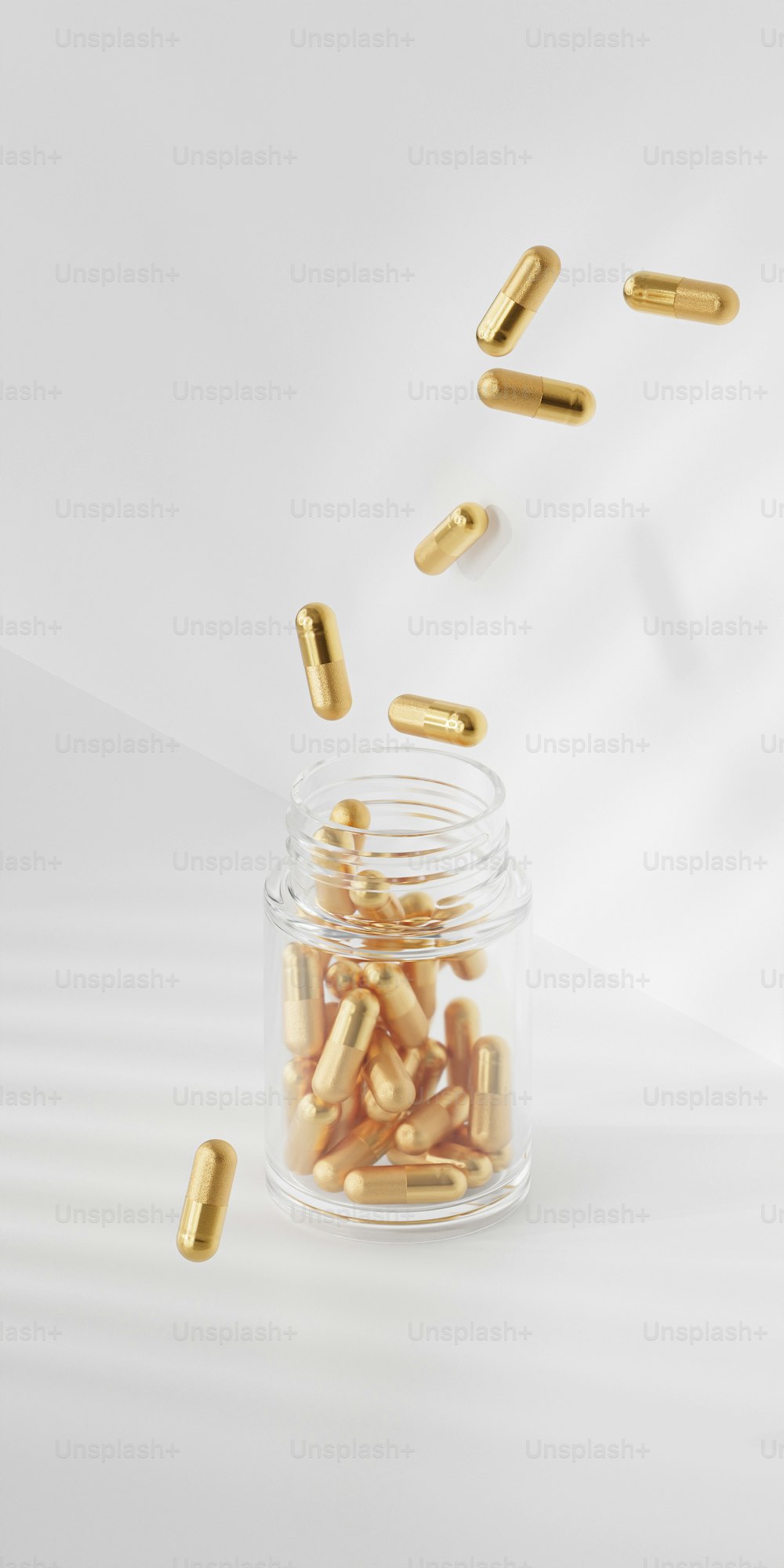 a glass jar filled with gold pills