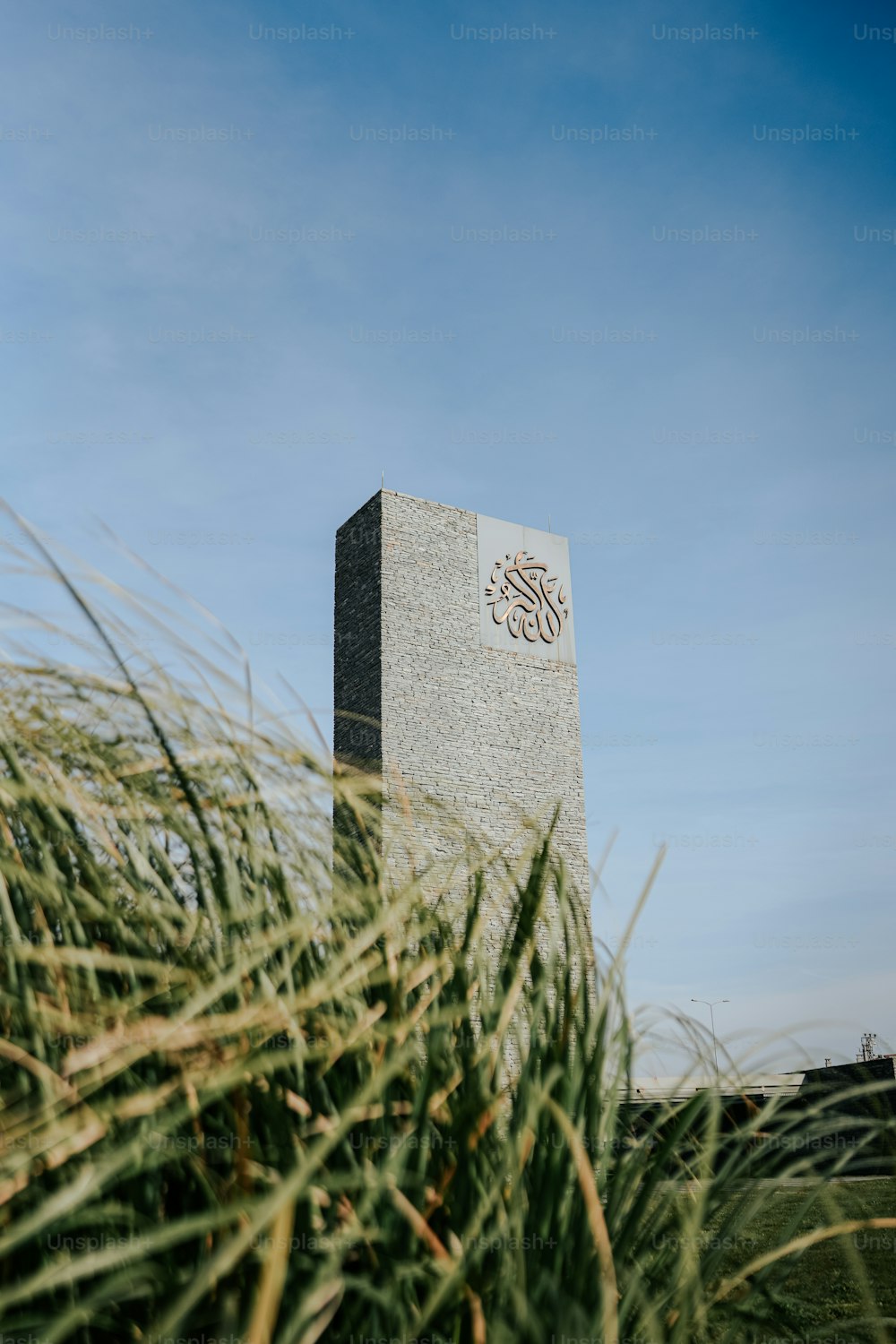 a monument in the middle of a grassy field