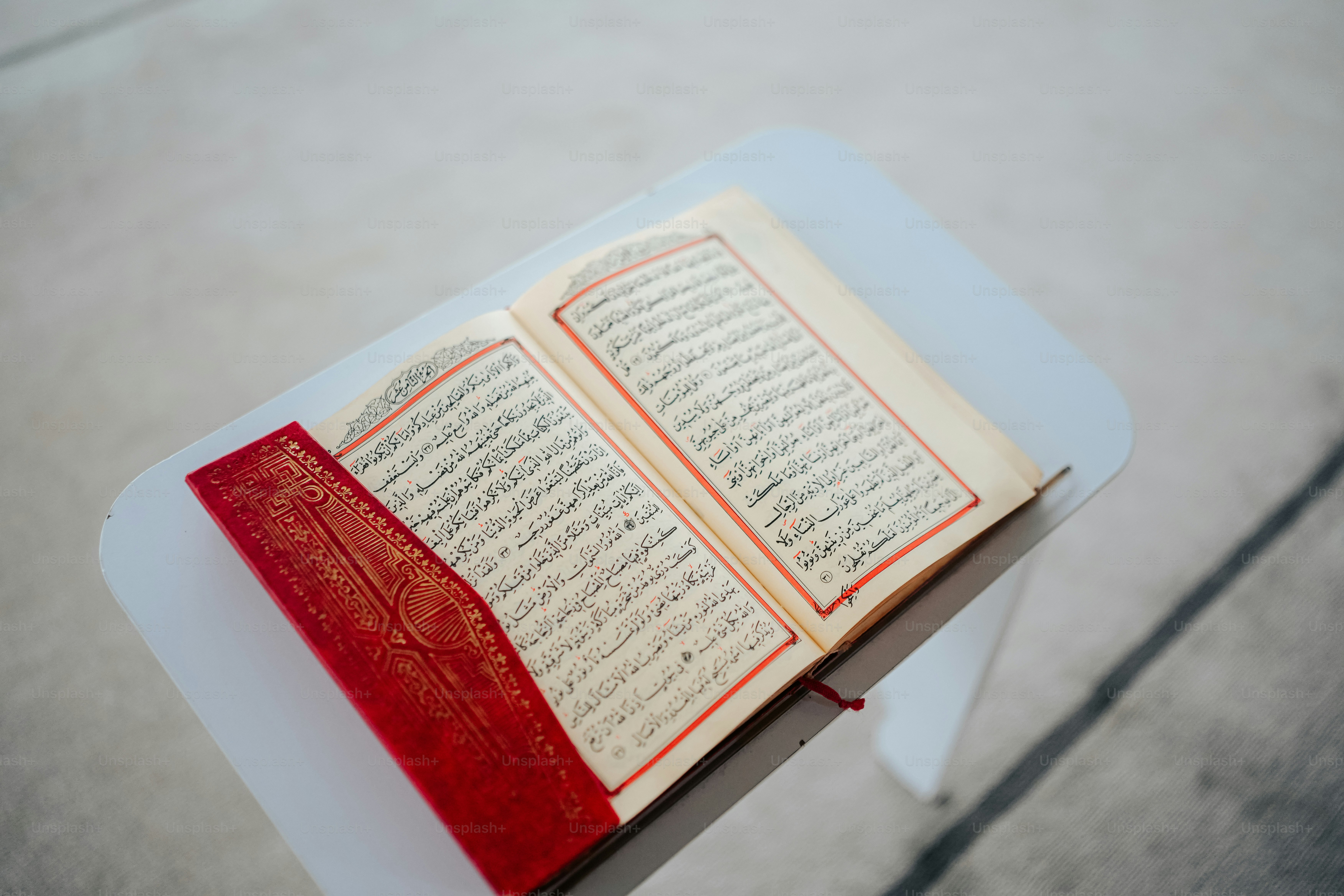 an open book sitting on top of a white table