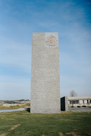 a tall monument with a sign on the side of it