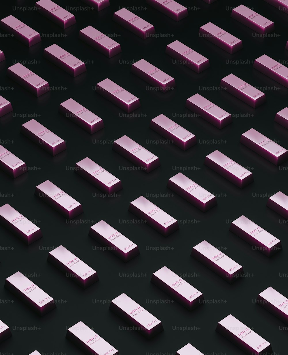 a group of pink squares on a black surface