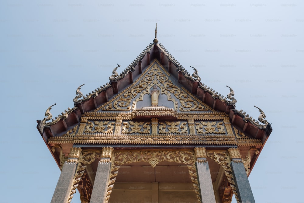 a tall tower with a clock on the top of it