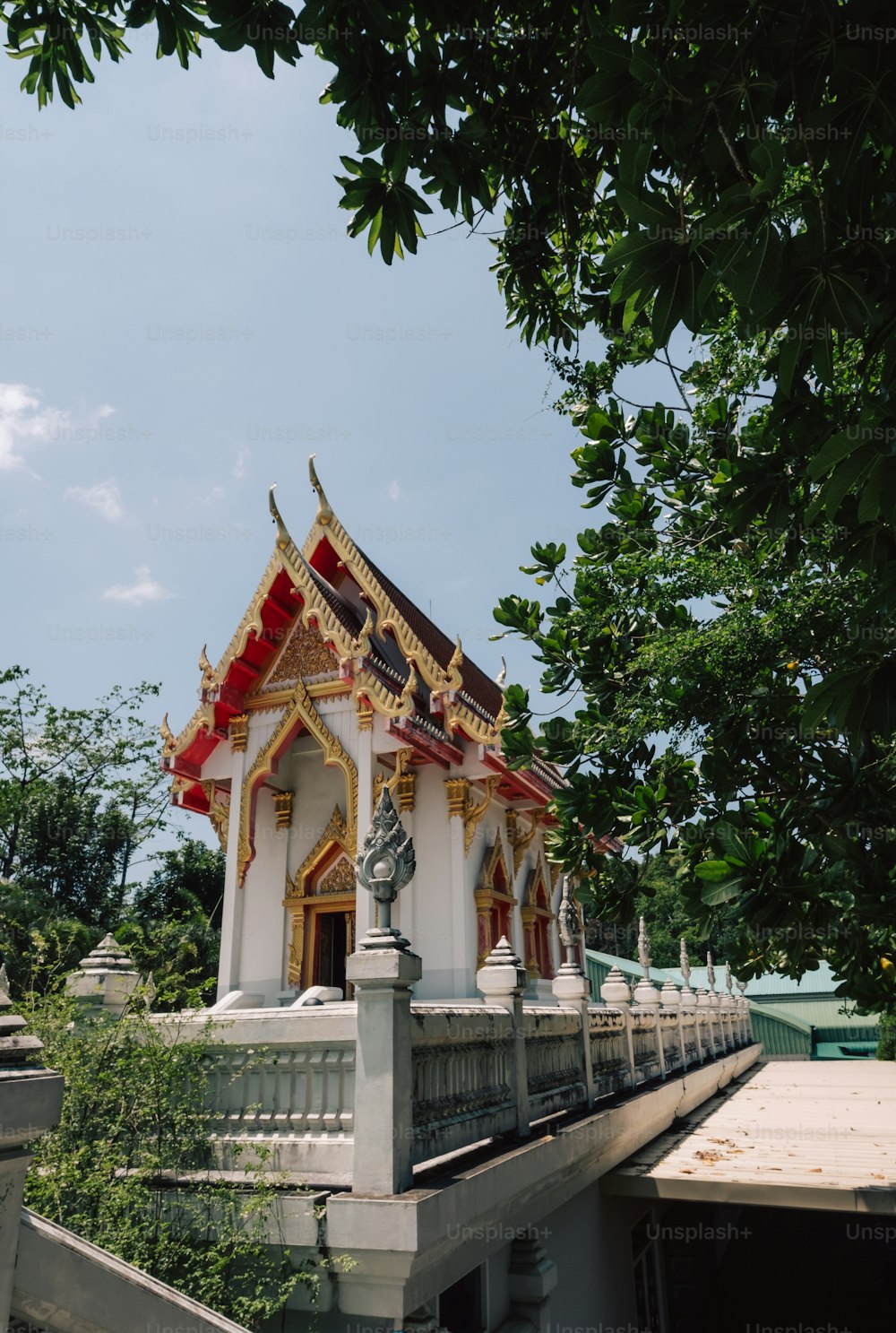 a white and red building with a statue on top of it