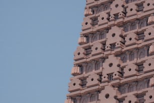 a very tall building with a clock on it's side