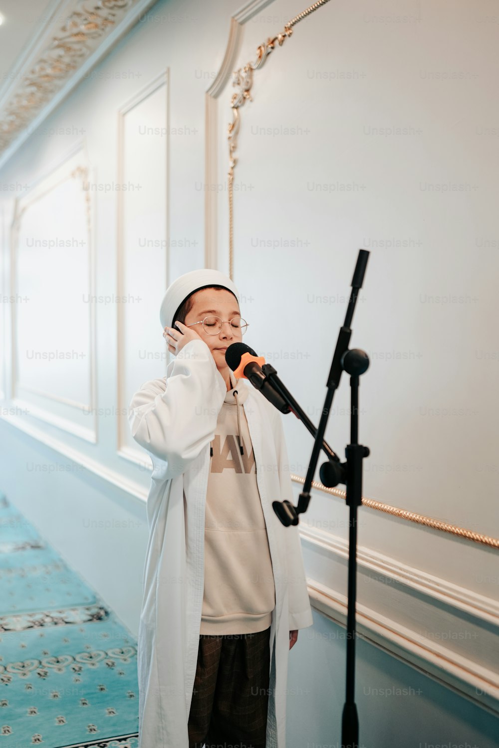 a woman standing in front of a microphone