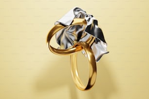 a gold and silver ring on a yellow background