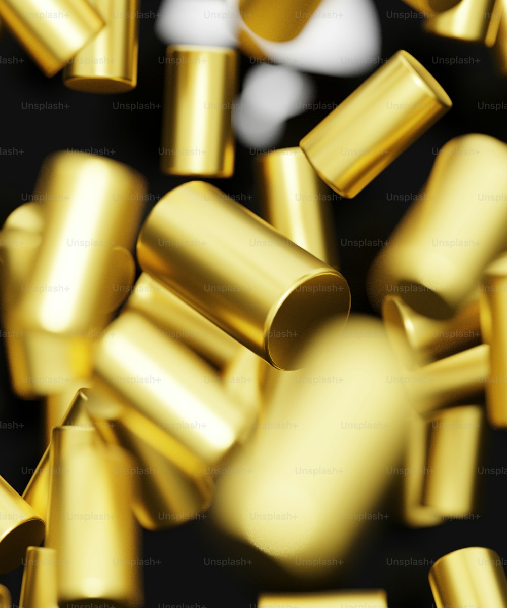 a bunch of shiny gold confetti on a black background