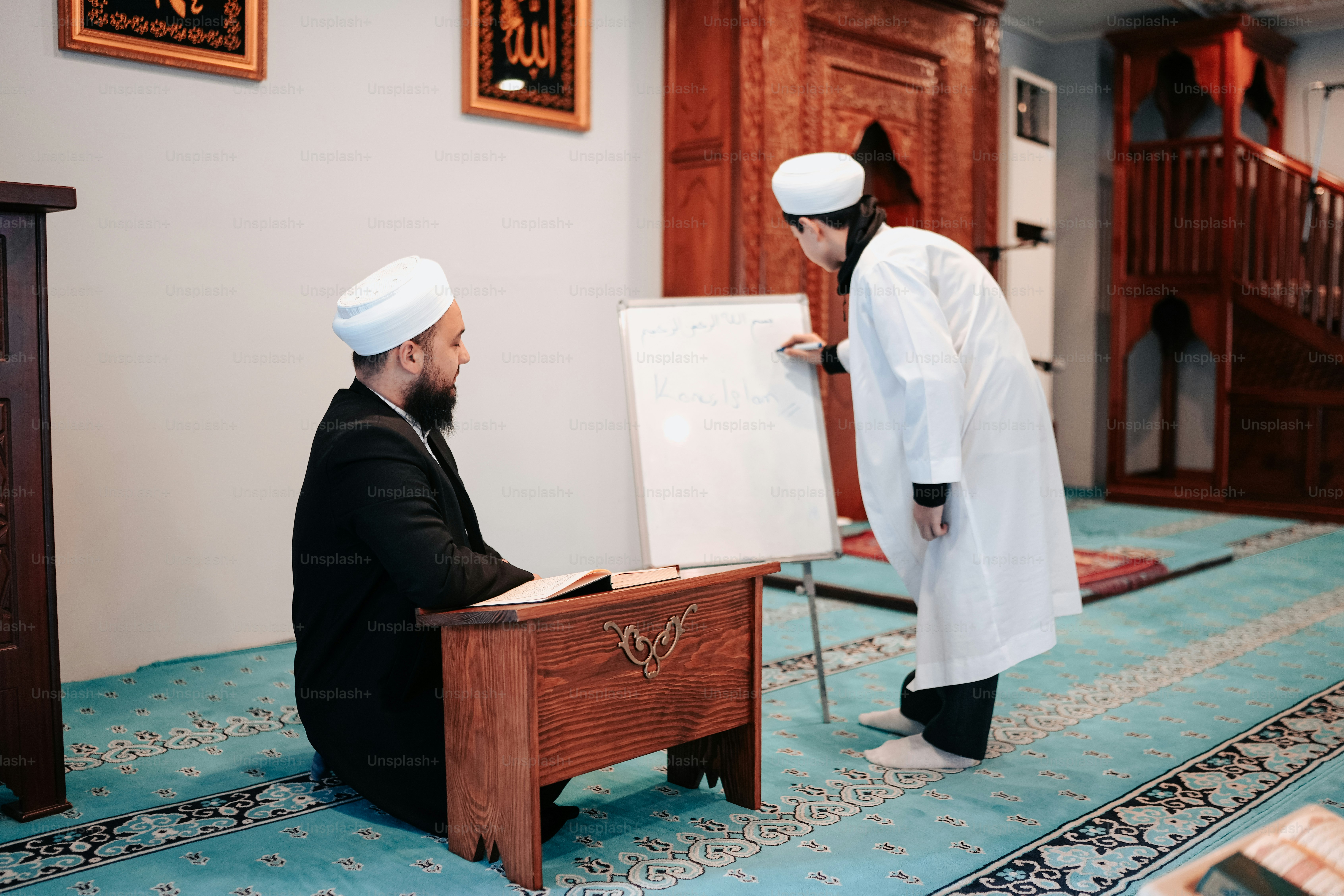 a man standing in front of a white board