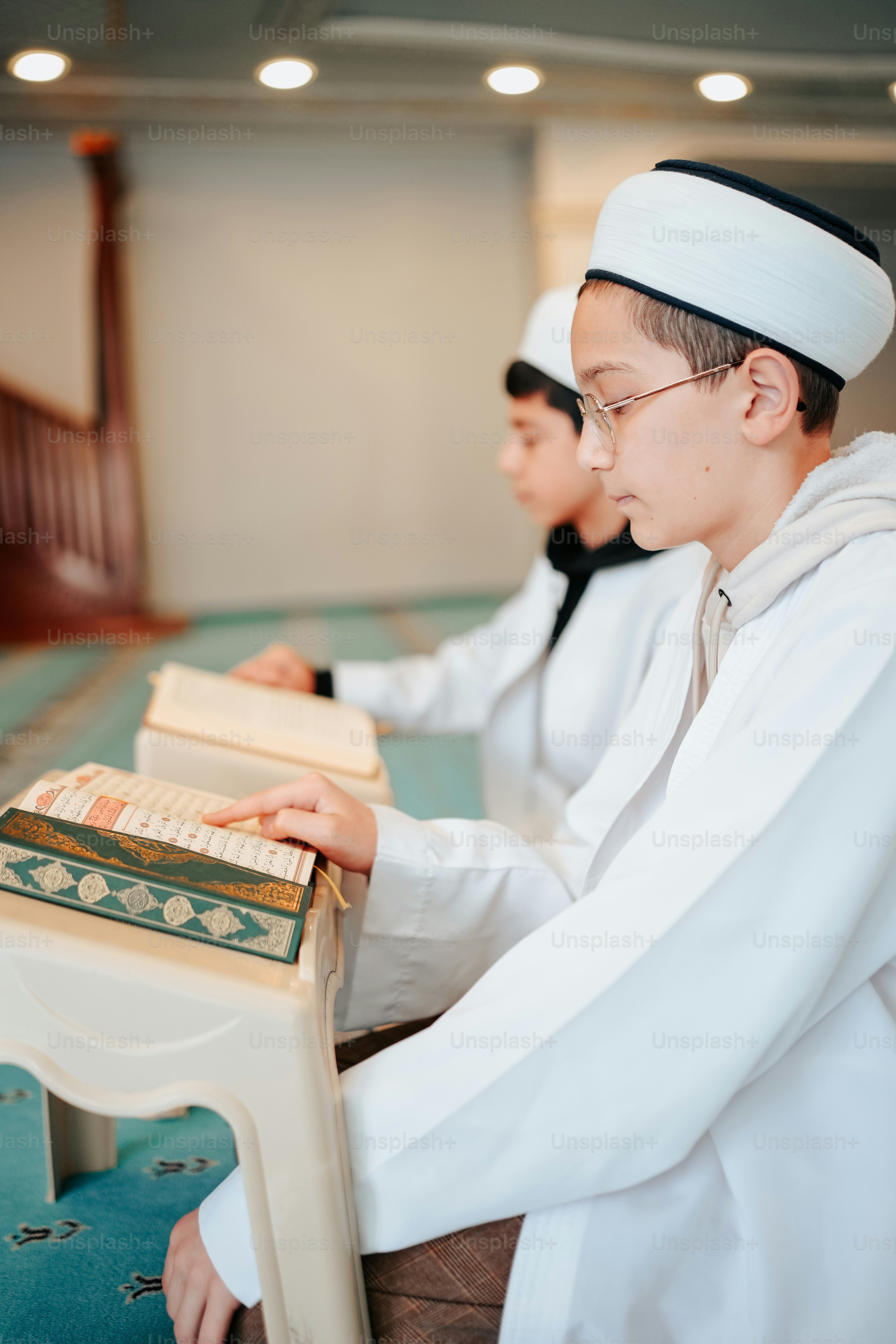 a couple of men sitting next to each other