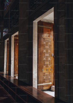 a long row of wooden doors in a building