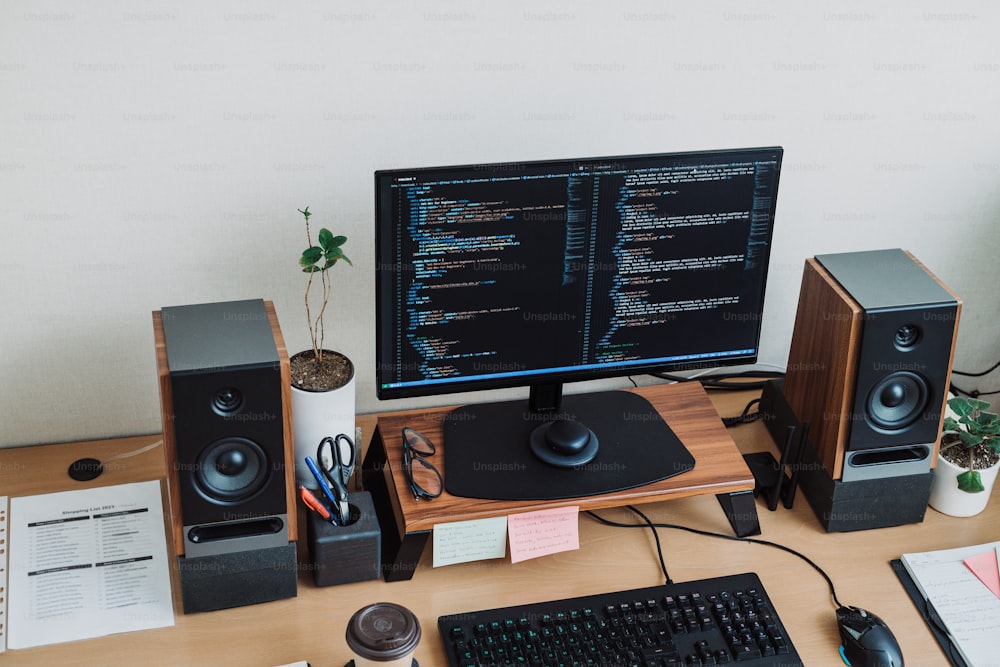 a desktop computer sitting on top of a wooden desk