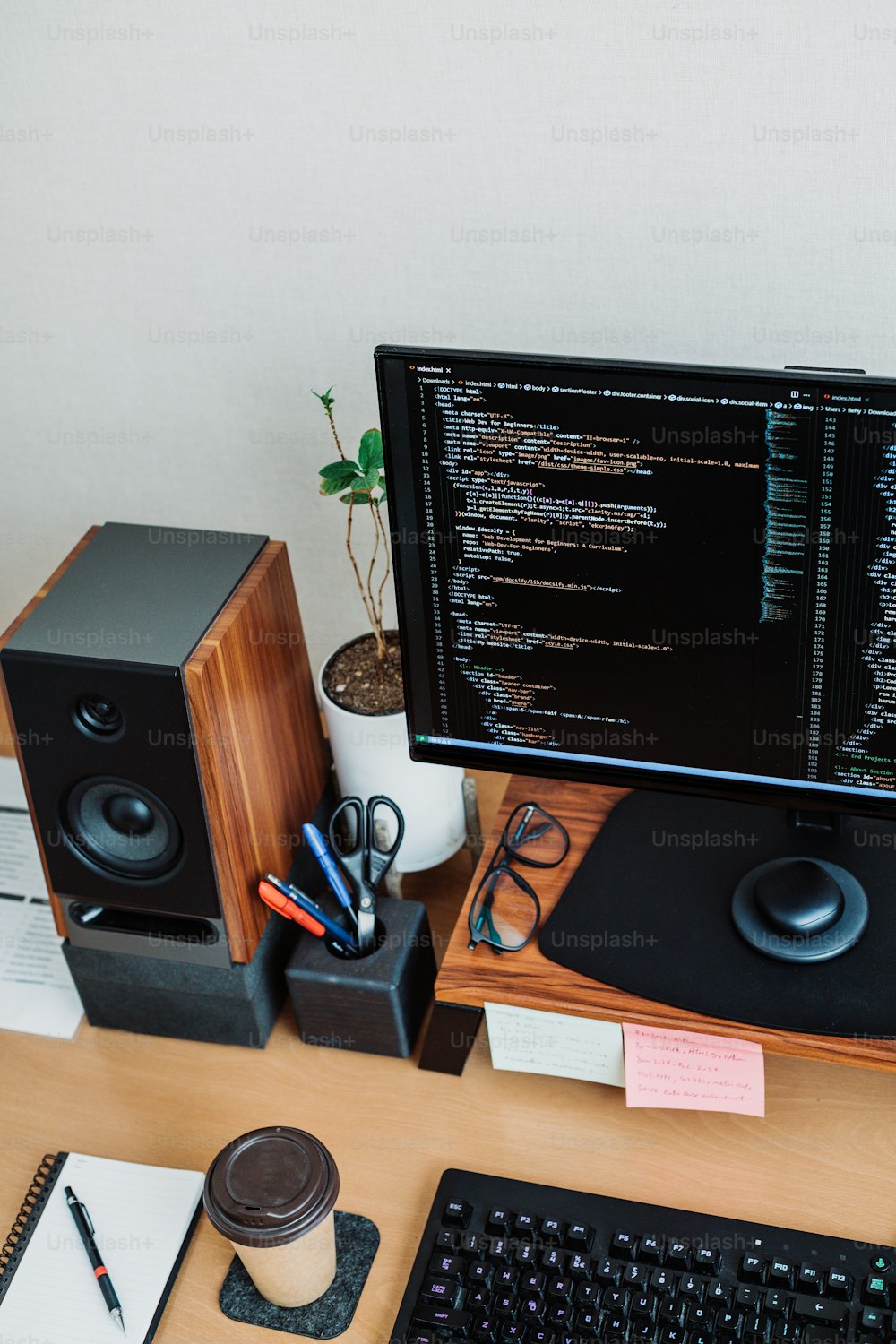 a computer monitor sitting on top of a wooden desk