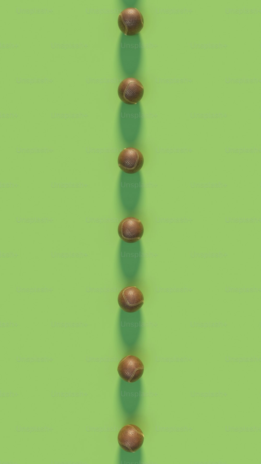 a long line of nuts on a green background