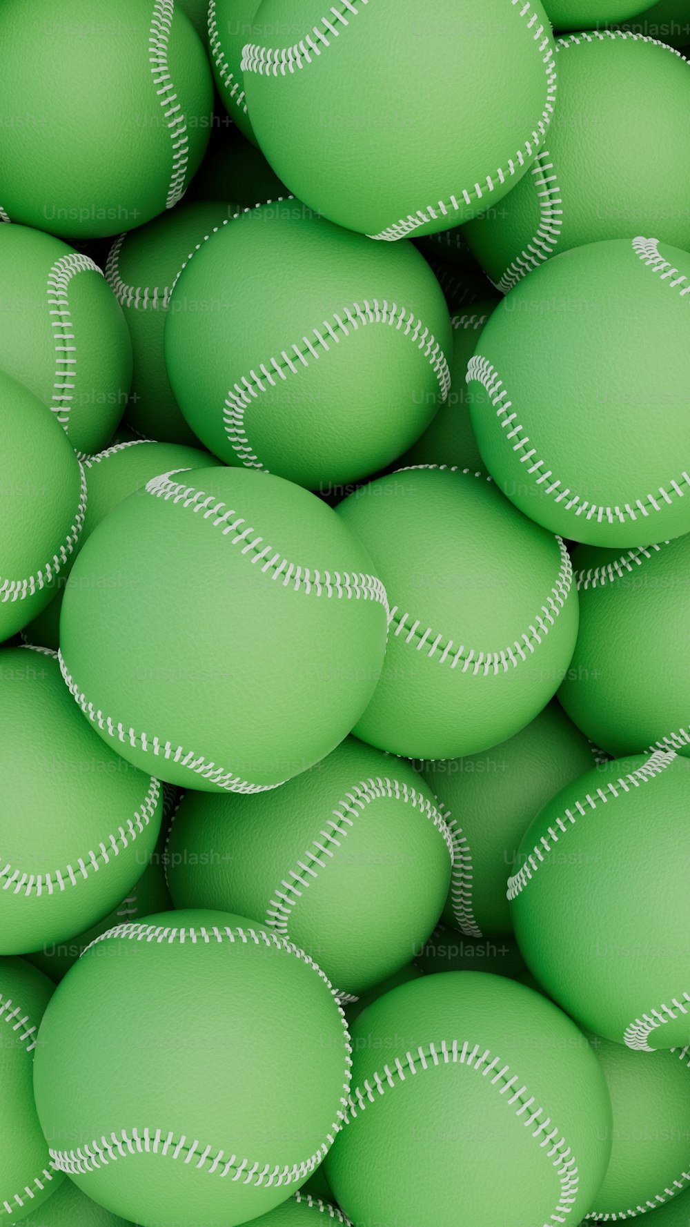 Un montón de bolas verdes con puntadas blancas