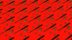 a red background with lots of black and gold objects