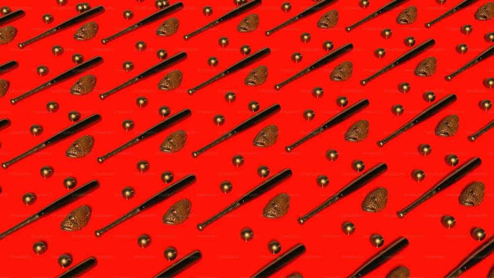 ein roter Hintergrund mit vielen schwarzen und goldenen Objekten