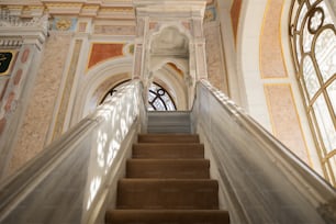 a staircase leading up to a window in a building