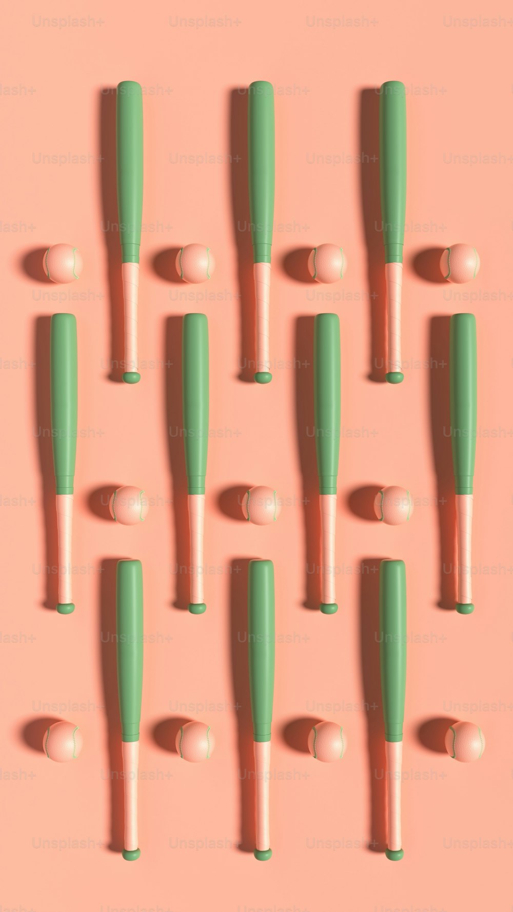 a group of green and white toothbrushes on a pink background