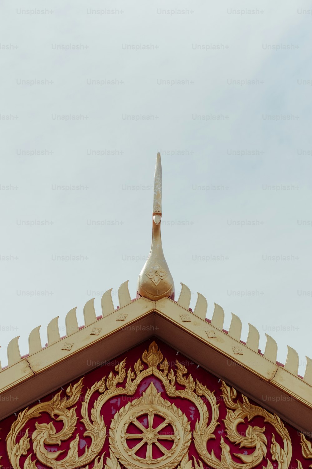 a close up of a roof with a bird on top of it