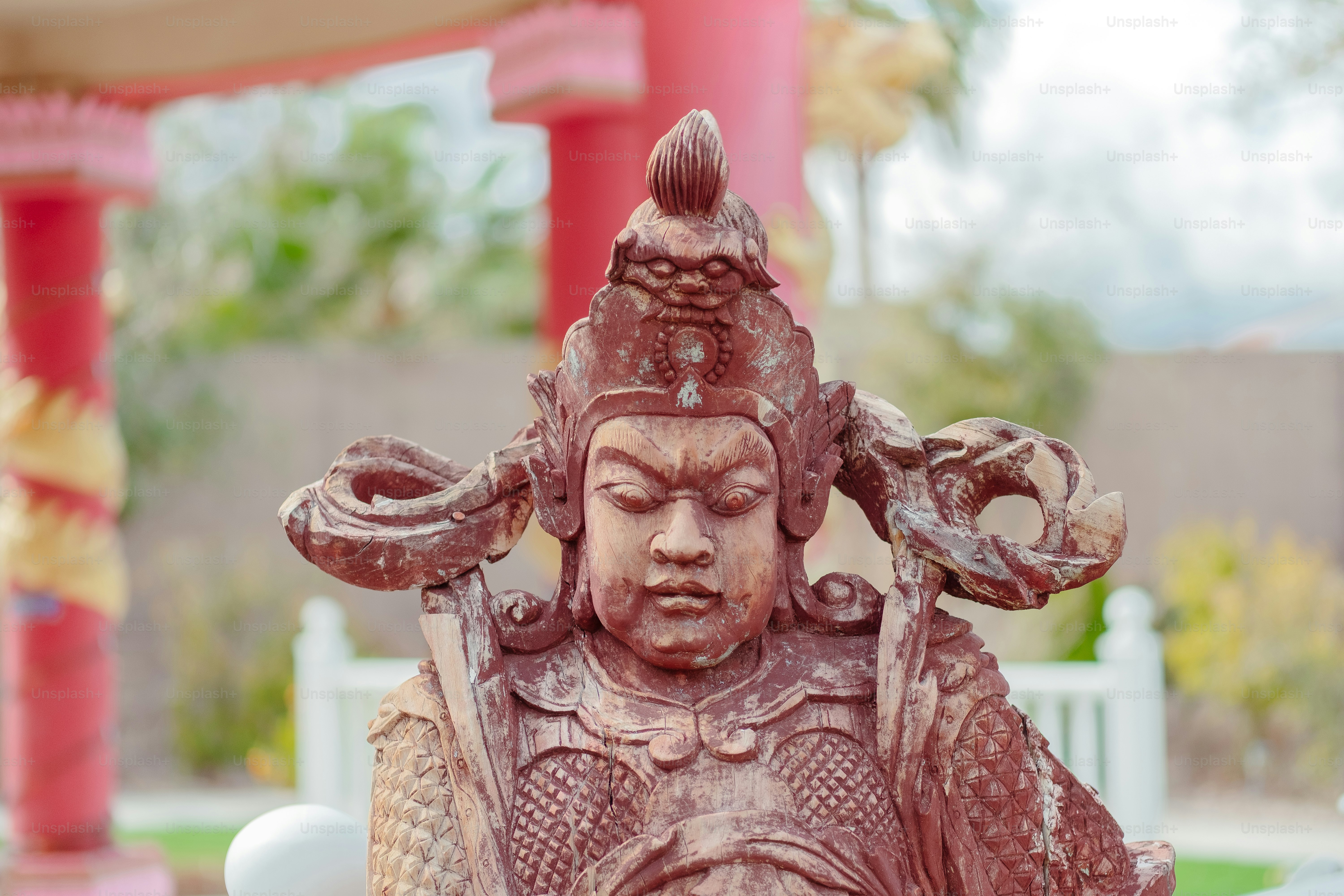 a statue of a person with a bird on his head