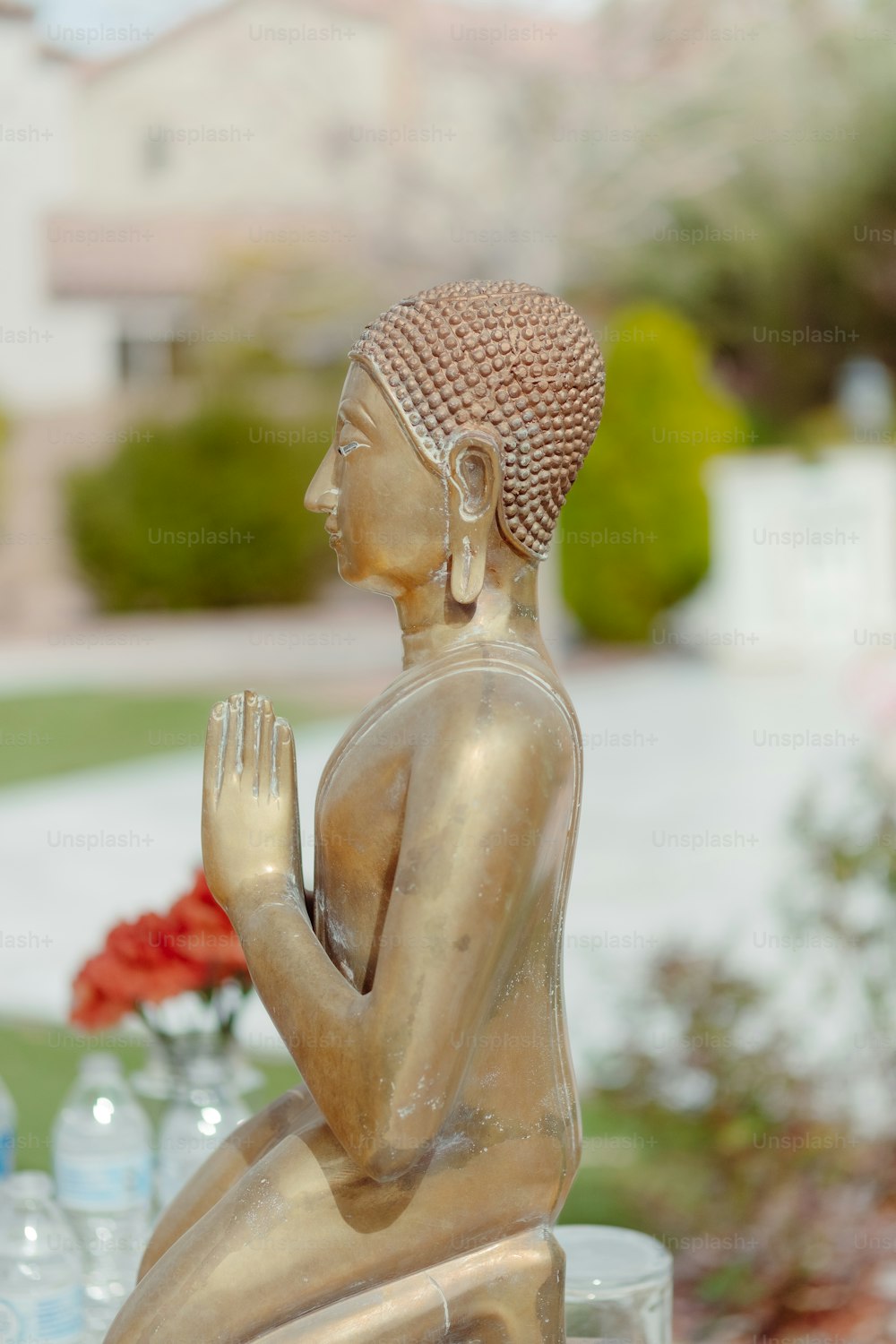 a statue of a buddha sitting on a table