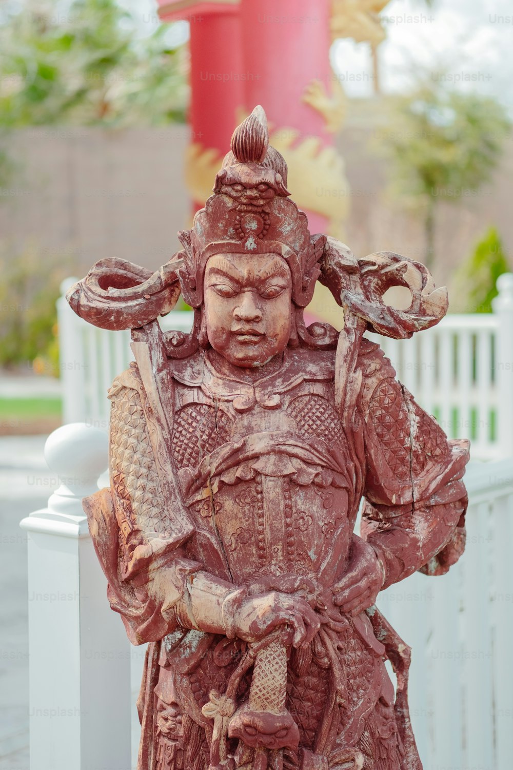 a statue of a man with a hat on his head