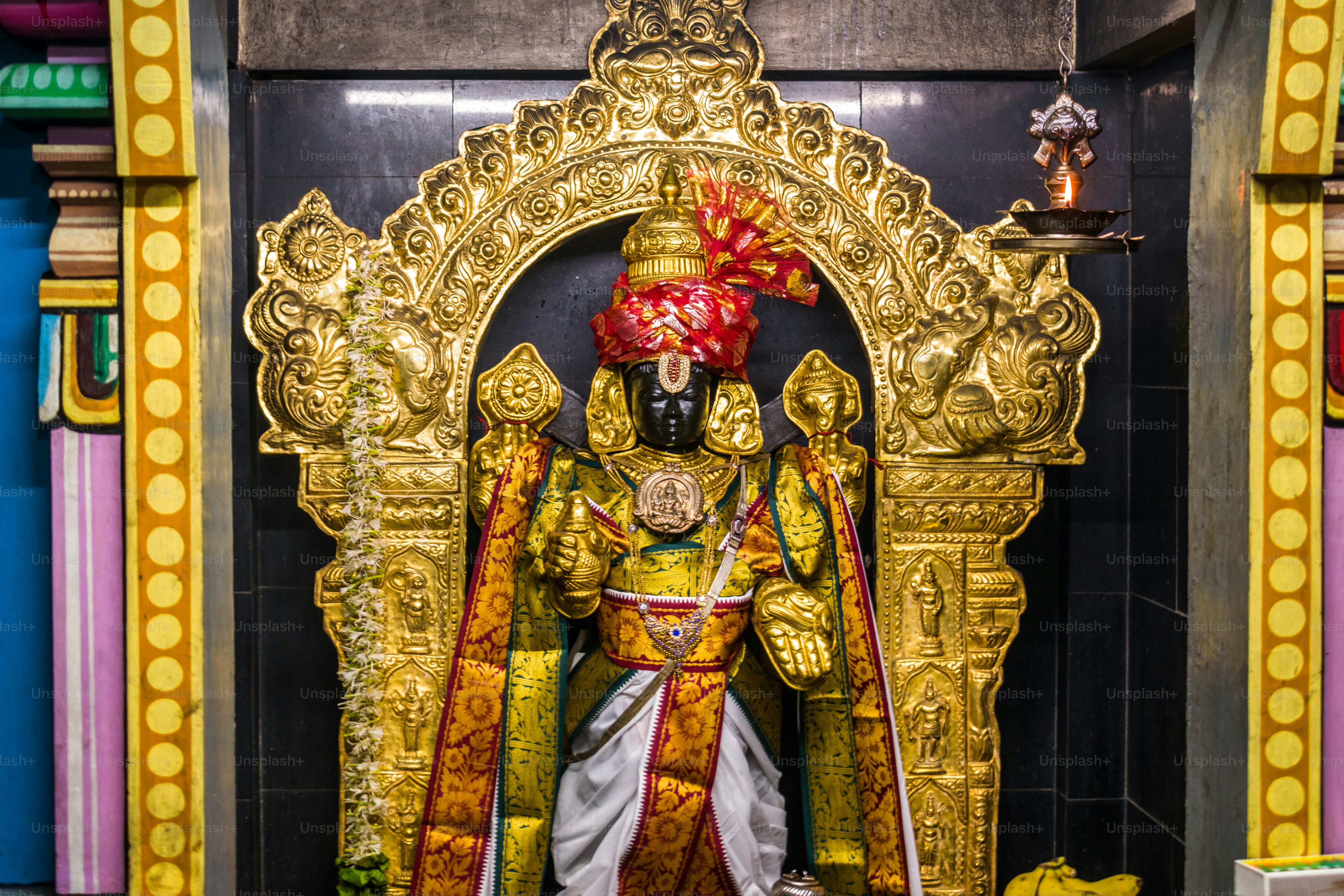 A statue of Dhanvantri avatar of Lord Vishnu at a Hindu temple in Mumbai, India