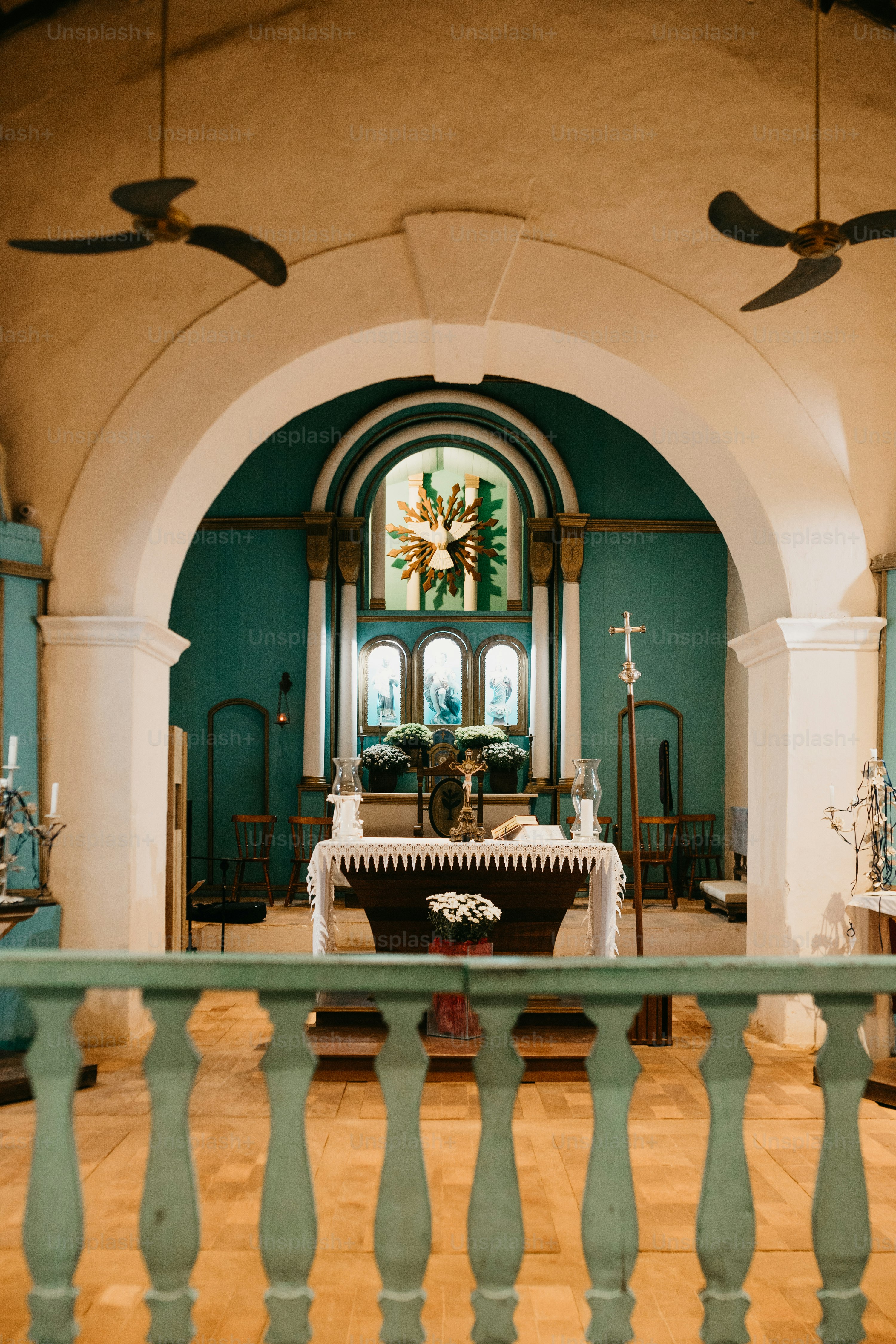 A white church with a cross on top of it photo – Building Image on Unsplash