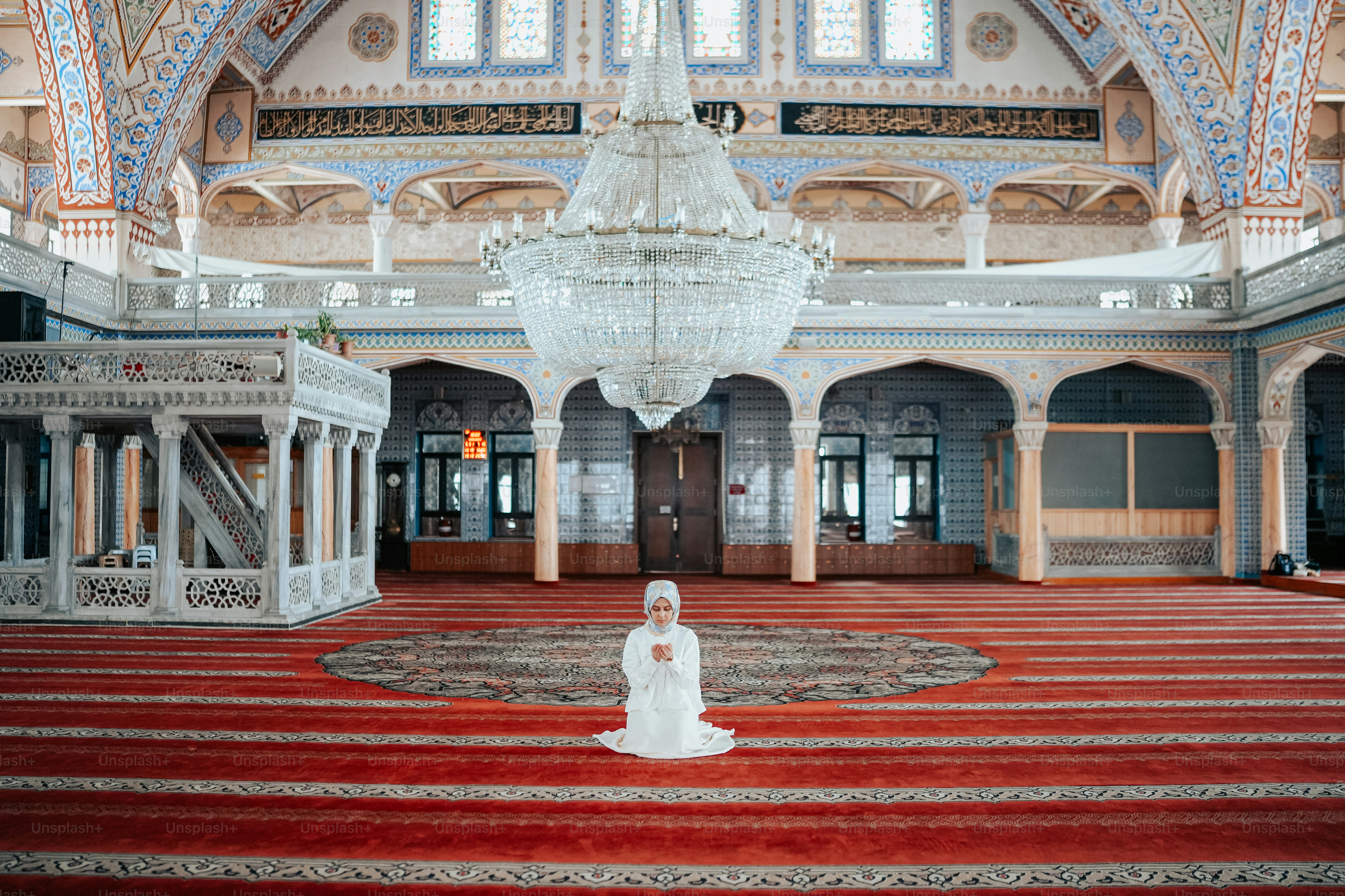 a chandelier hanging from the ceiling of a large room
