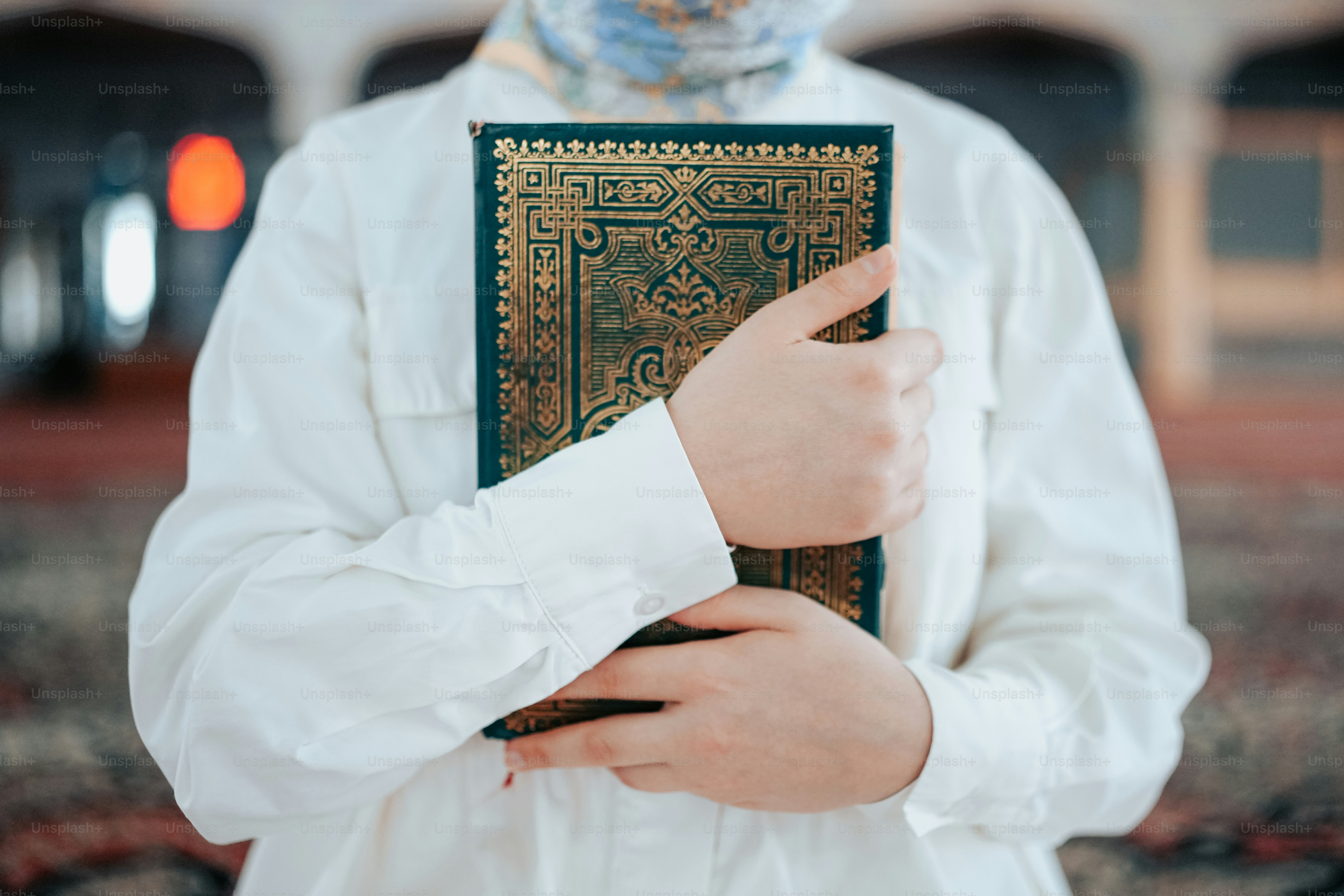 a person in a white shirt holding a book