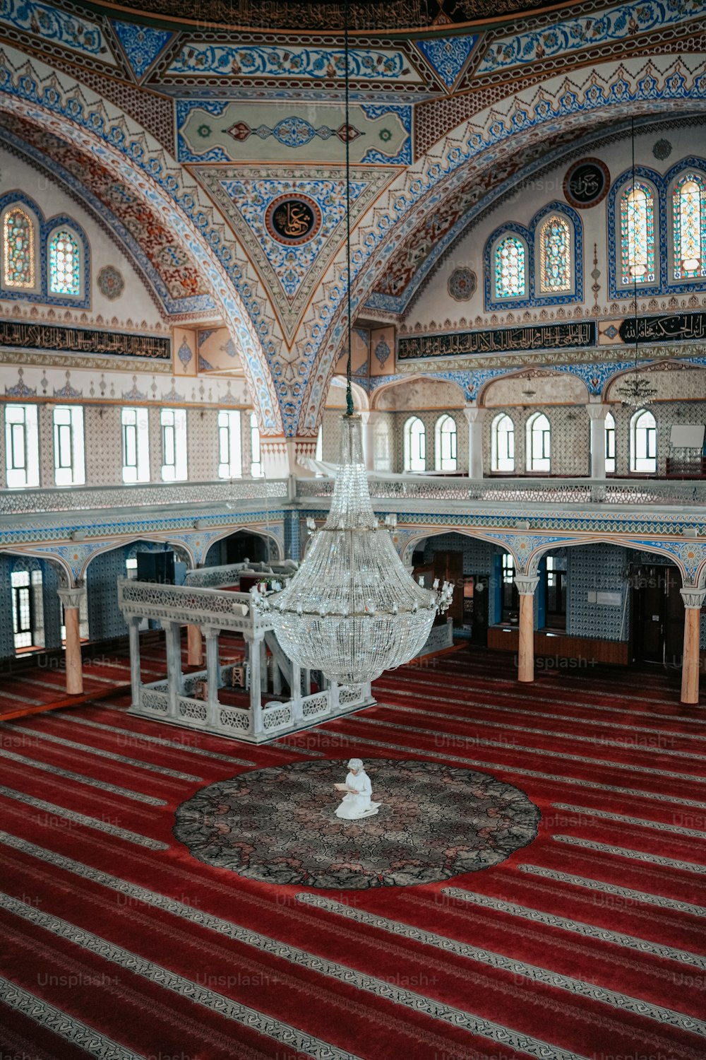 a large room with a chandelier hanging from the ceiling