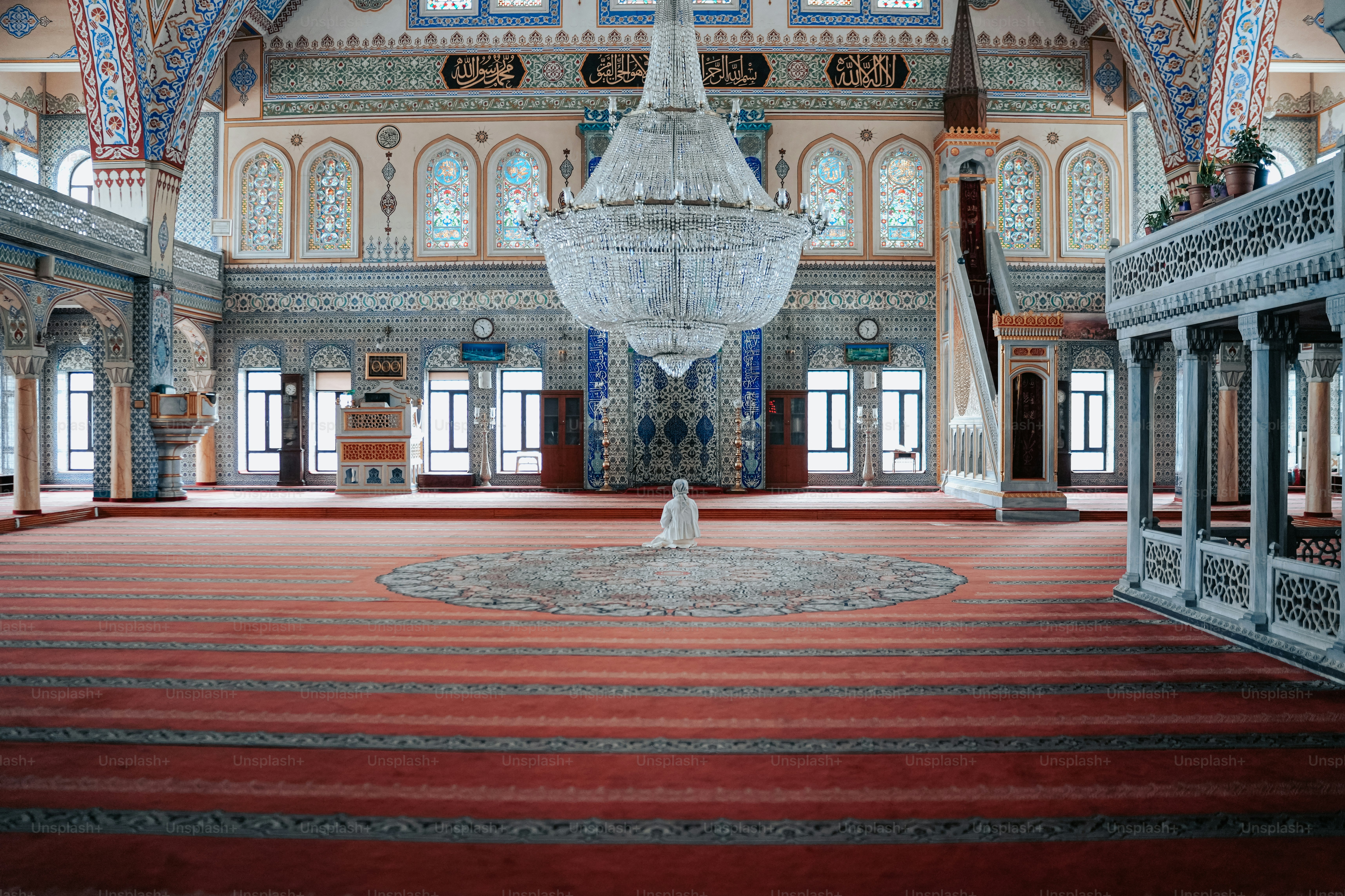 a chandelier hanging from the ceiling of a large room