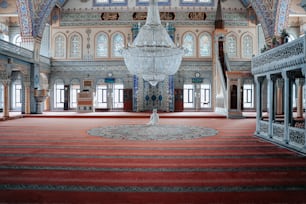 a chandelier hanging from the ceiling of a large room