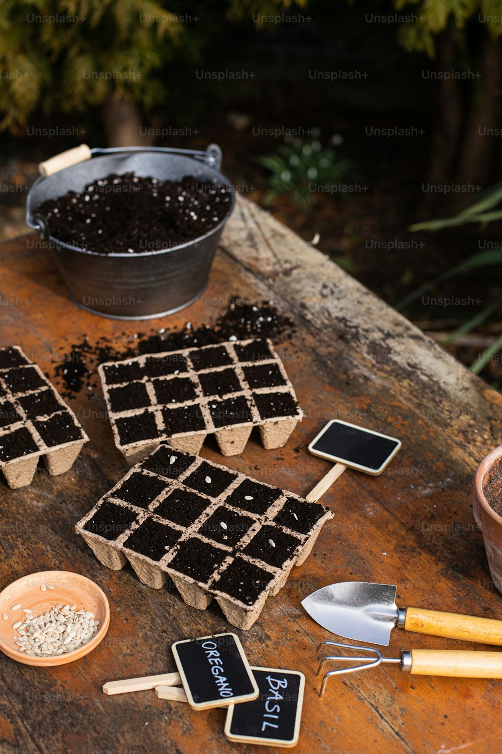 a wooden table topped with lots of chocolate squares