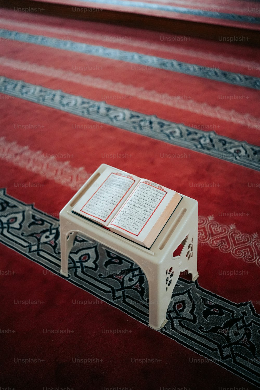 a small table with a book on top of it