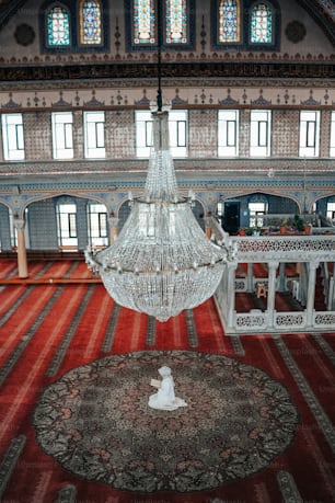 a chandelier hanging from the ceiling of a large room