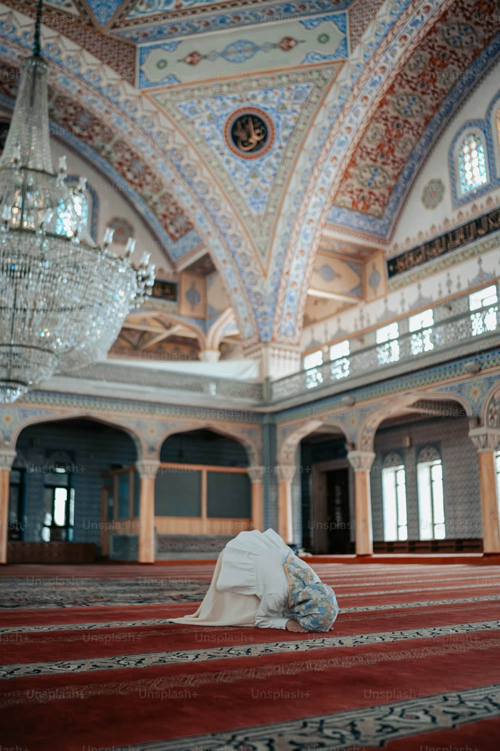 a person laying on the floor in a large room