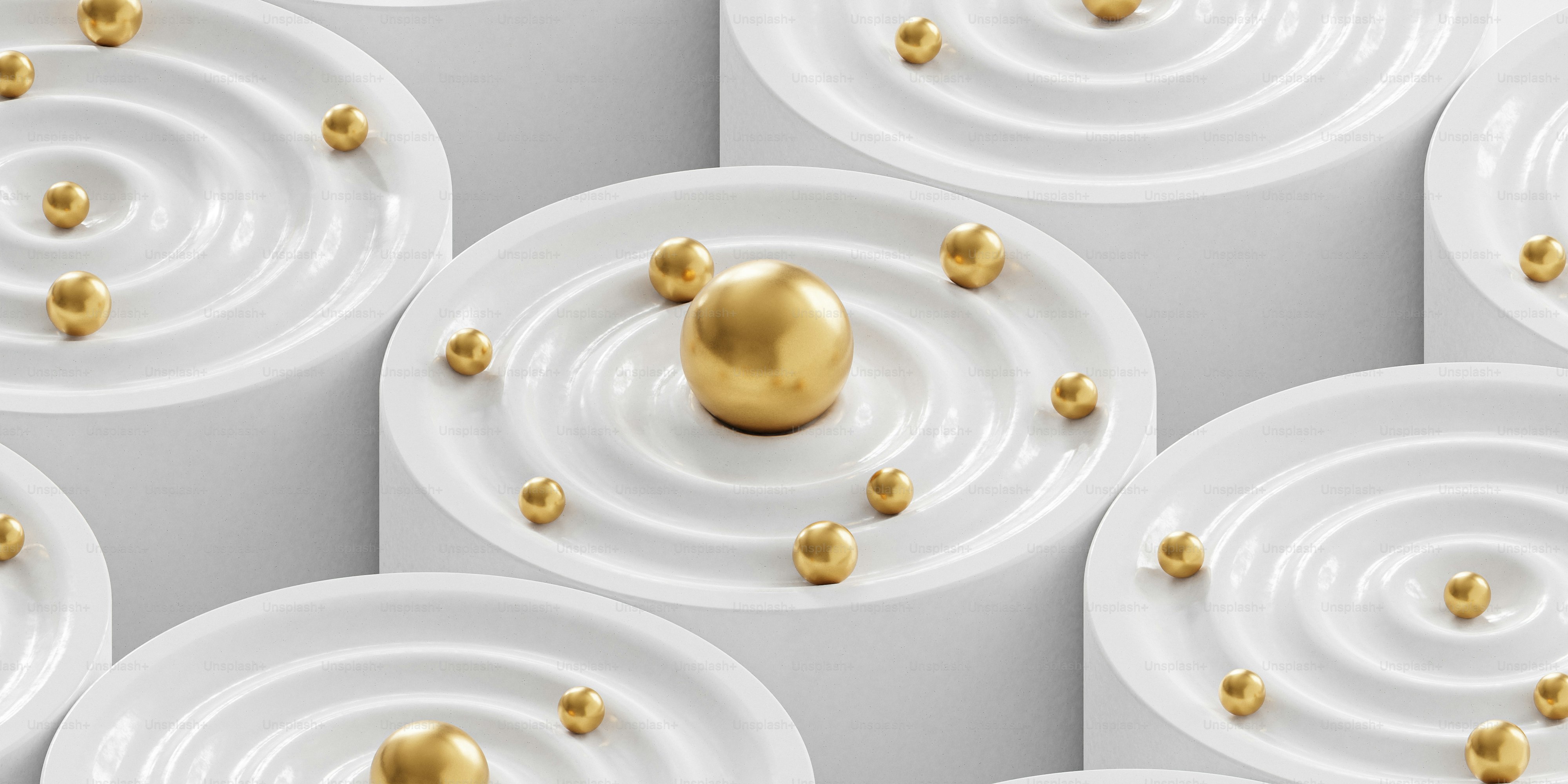 a group of white plates with gold balls on them