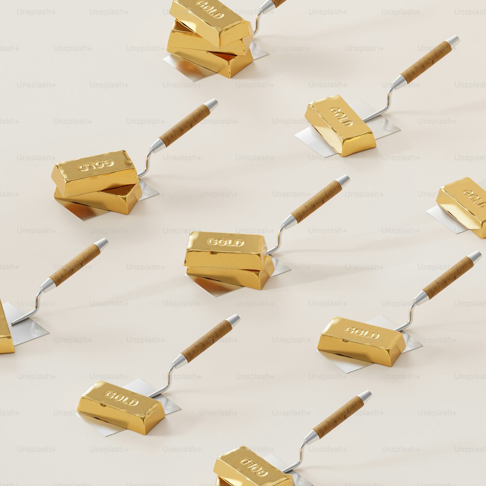 a group of gold bars connected to a toothbrush