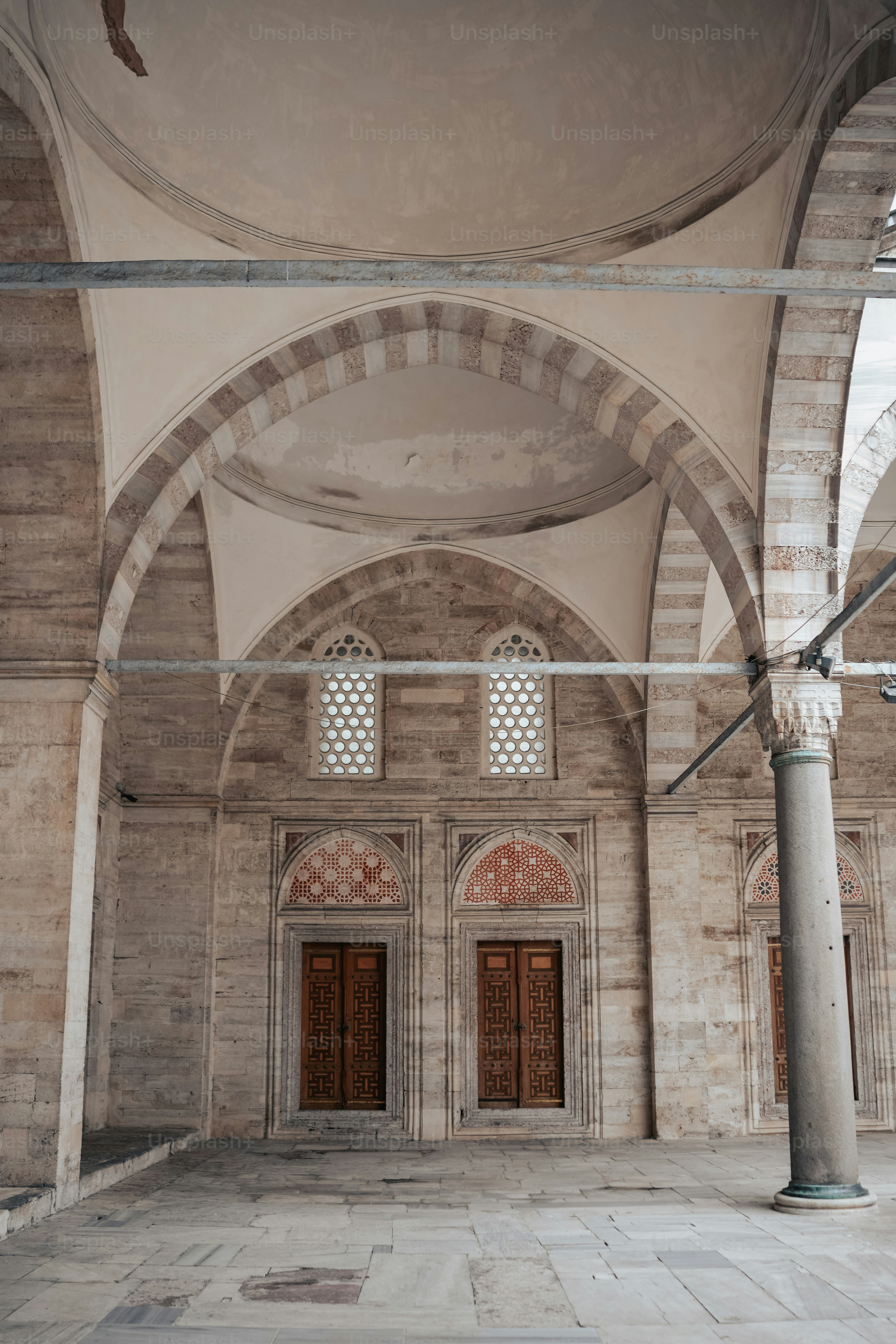 a large room with two doors and a ceiling