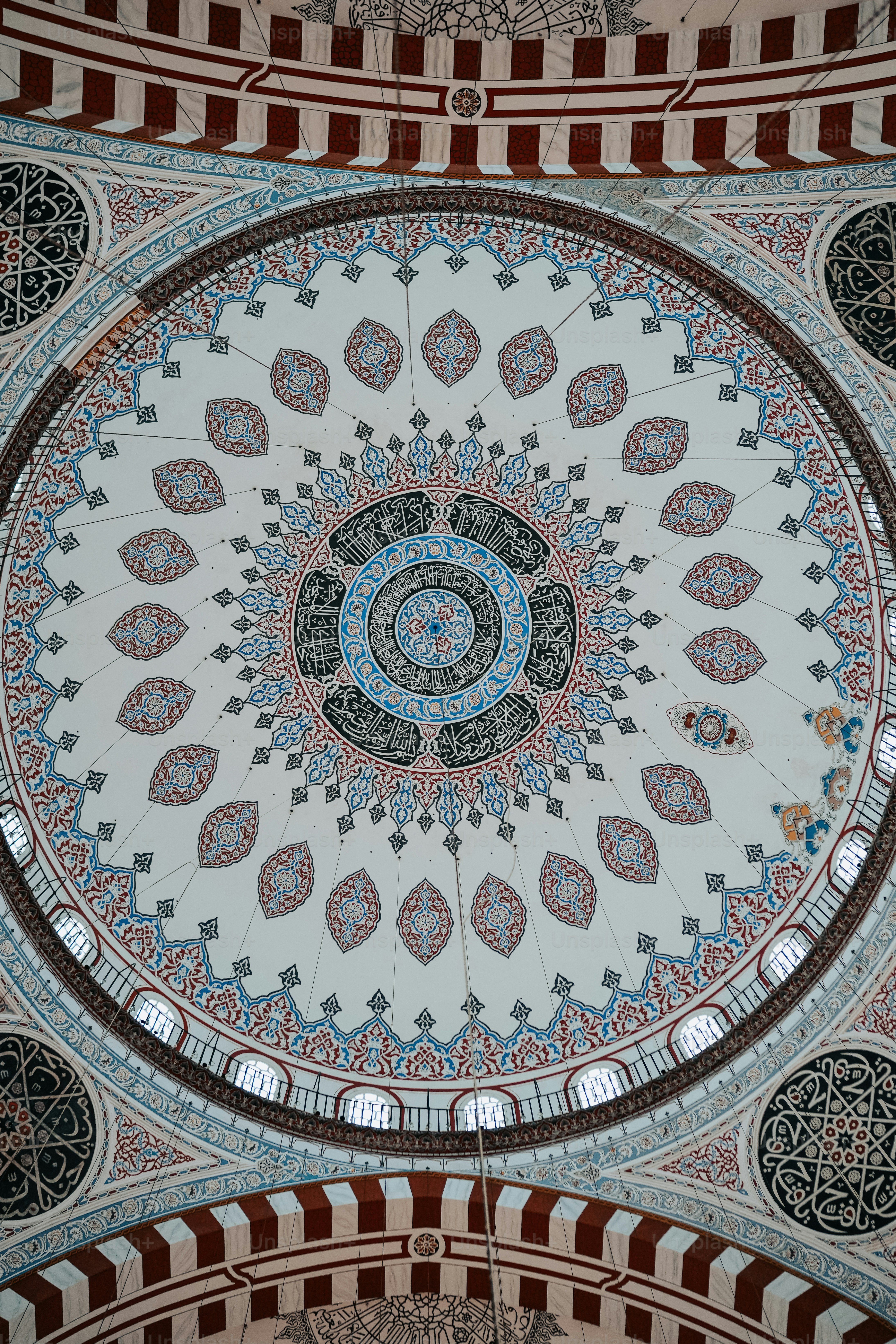 the ceiling of a building with a circular design on it