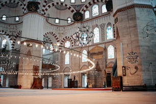 the inside of a building with chandeliers hanging from the ceiling