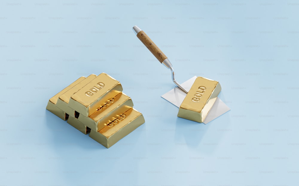 a gold stamp and a pen on a blue background