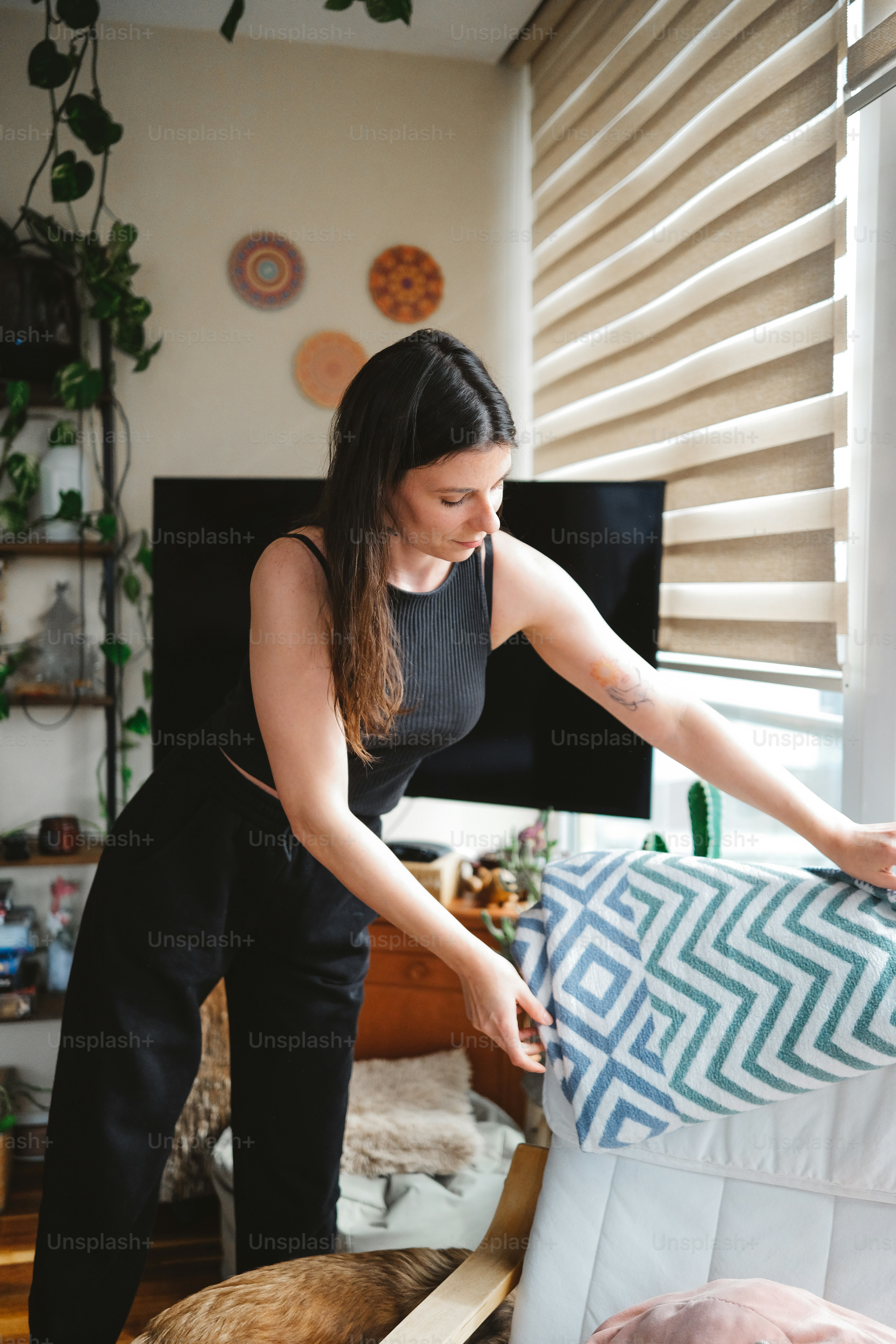 a woman holding a piece of fabric in her hands