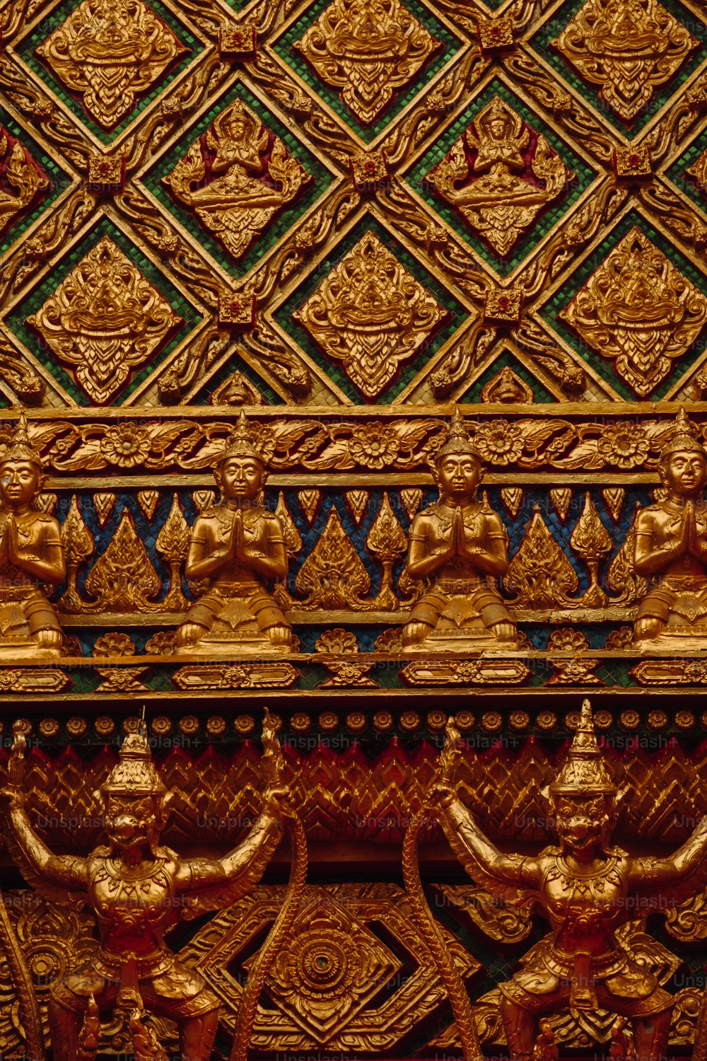 a close up of a gold sculpture on a wall