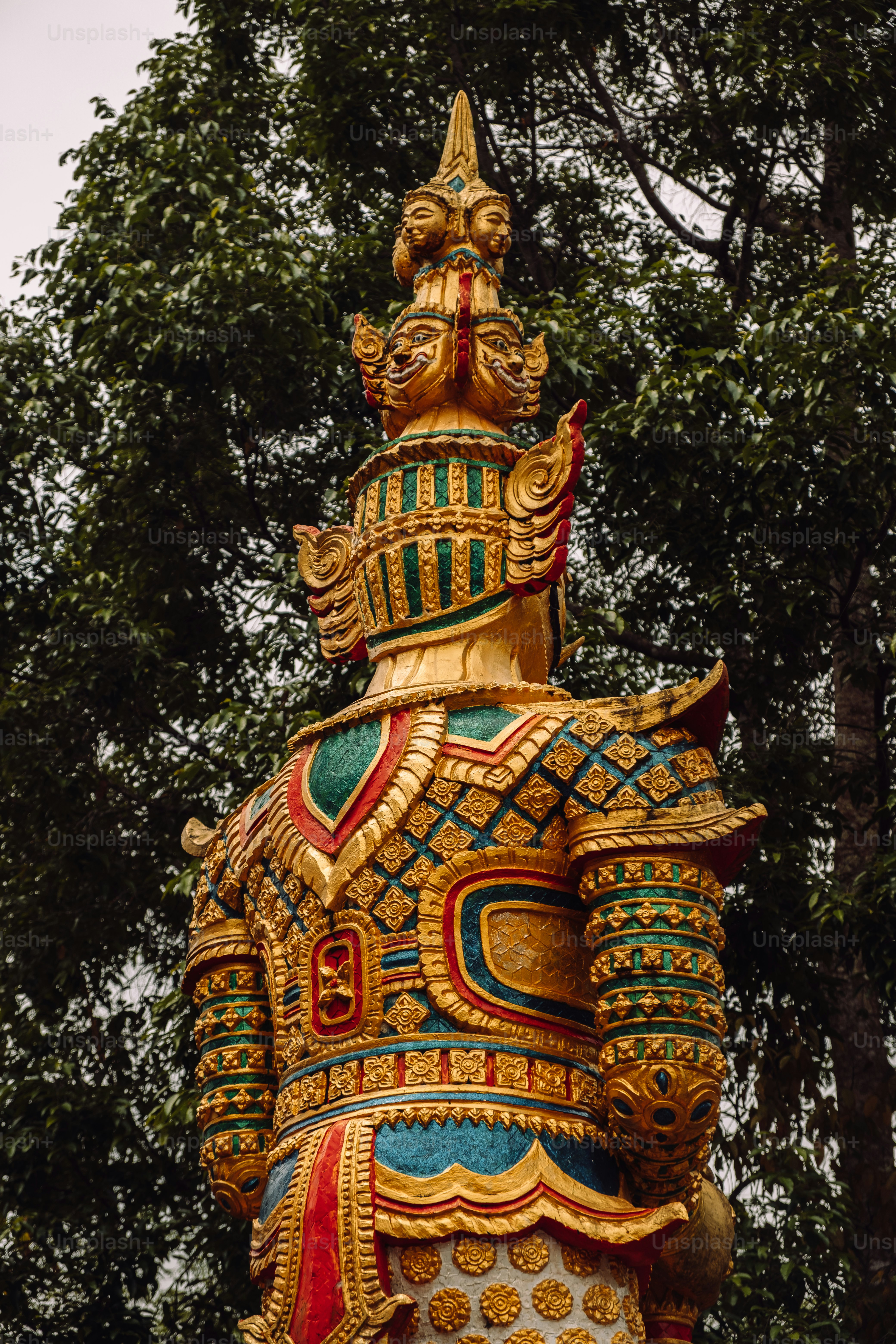 a statue of a man with a crown on top of it