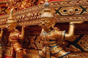 a close up of a gold statue on display