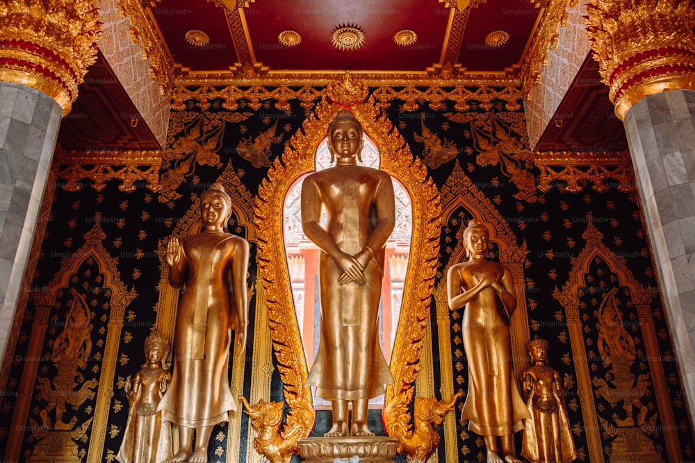 a large golden statue in the middle of a room