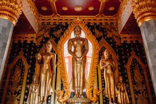 a large golden statue in the middle of a room